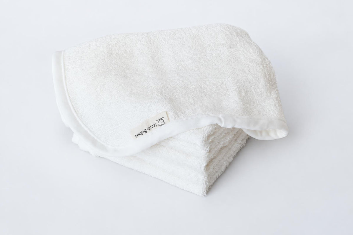Lamb Babies Baby Washcloths in White, folded stack