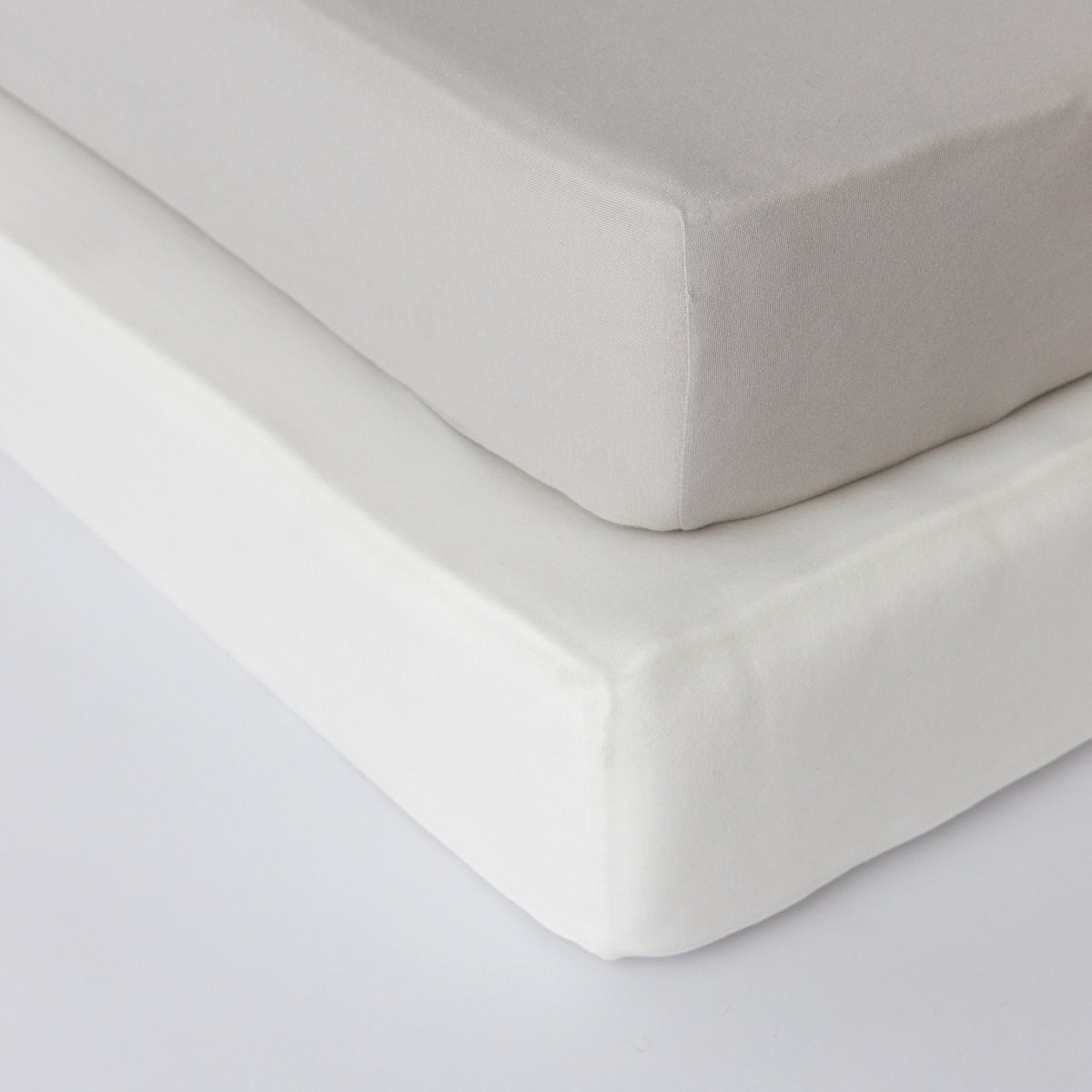 Lamb Babies Comfort Fitted Crib Sheet in Gray on a crib mattress