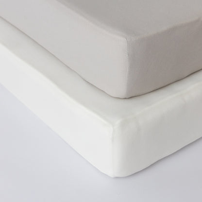 Lamb Babies Comfort Fitted Crib Sheet in Gray on a crib mattress