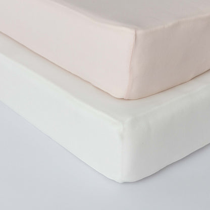Lamb Babies Comfort Fitted Crib Sheet in Pink on a crib mattress