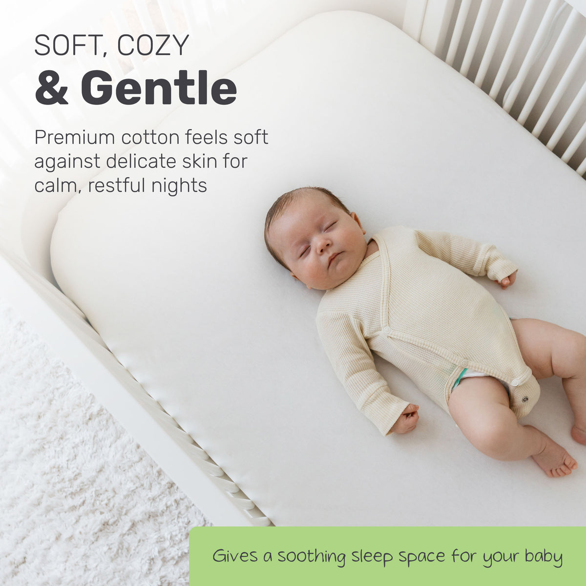 Baby lying on a Lamb Babies cotton crib sheet