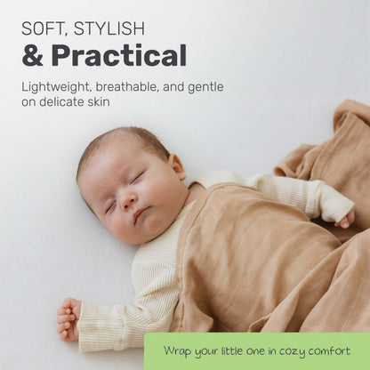 Baby sleeping under a Lamb Babies muslin swaddle blanket