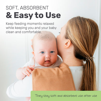 Parent holding a baby with a Lamb Babies burp cloth on the shoulder