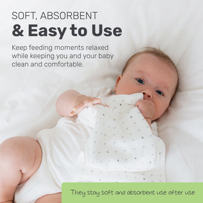 Baby lying on a patterned Lamb Babies Posh Burp Cloth