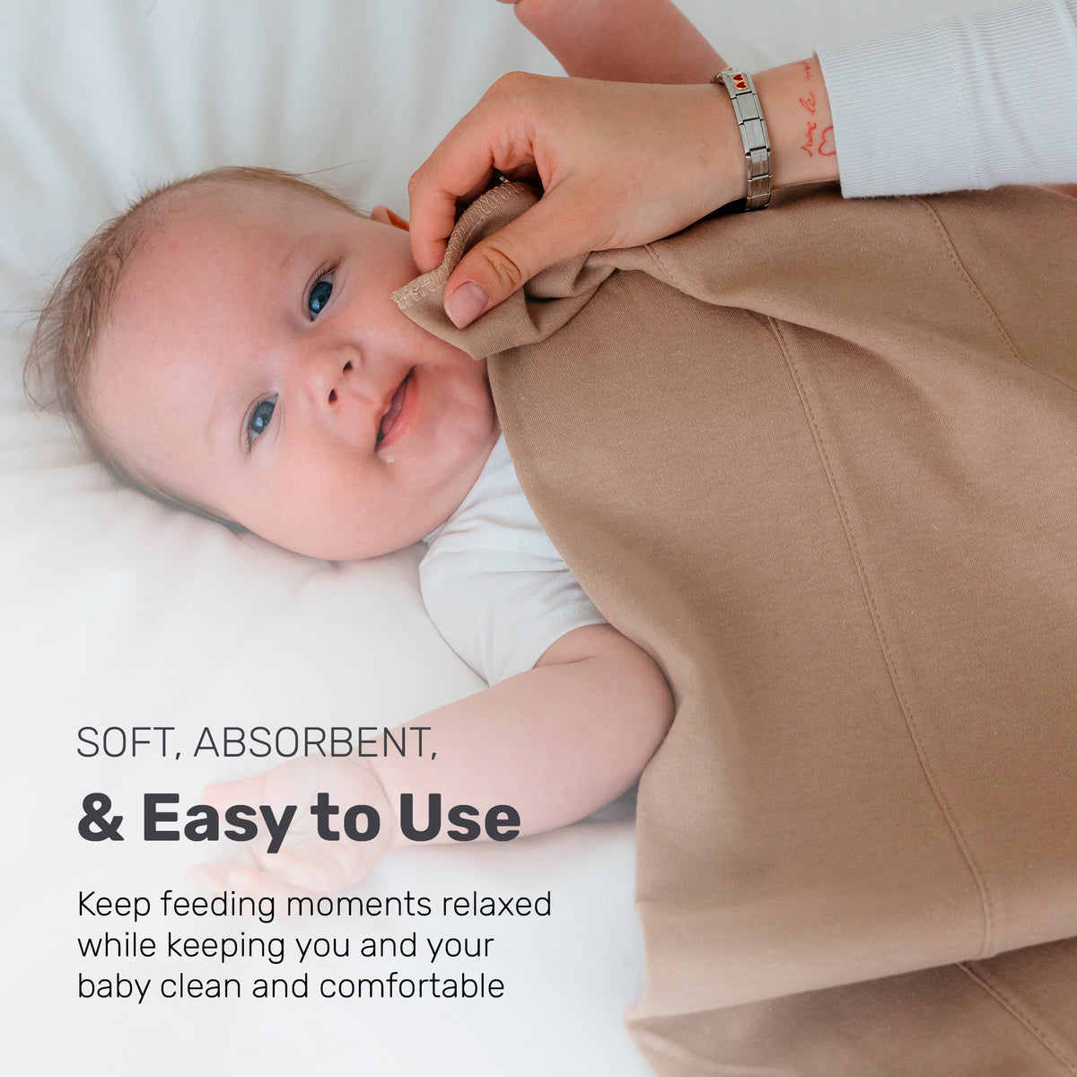 Baby with a tan Lamb Babies Snug Burp Cloth