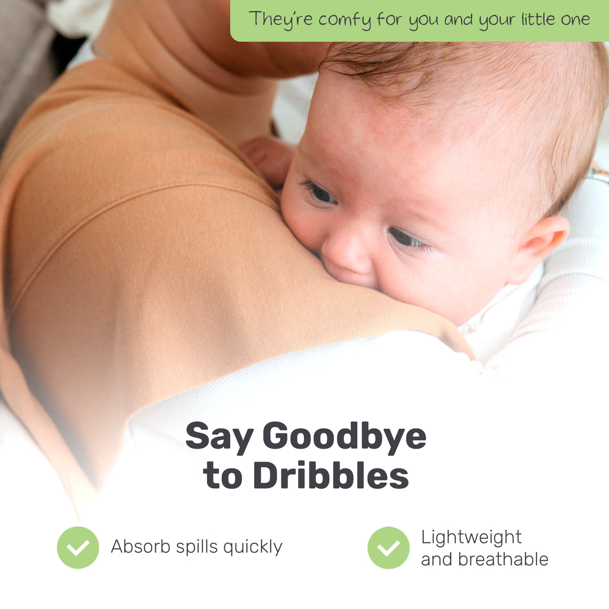 Parent holding a baby with a tan Lamb Babies Snug Burp Cloth