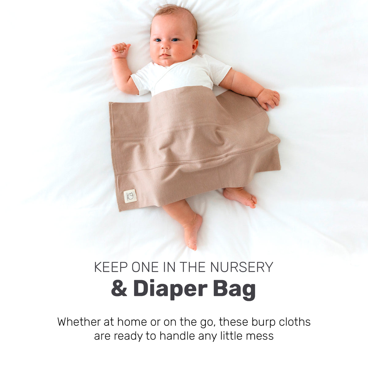 Baby with a brown Lamb Babies Snug Burp Cloth, for the nursery or diaper bag