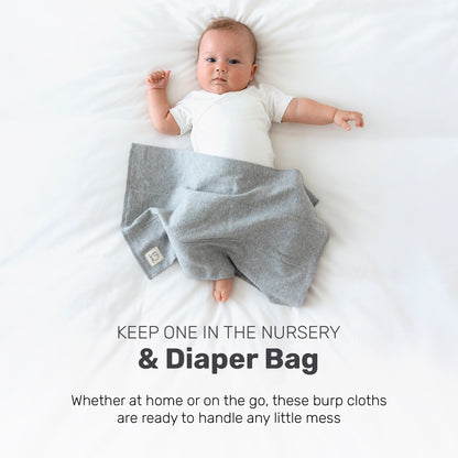 Baby with a patterned Lamb Babies Snug Burp Cloth, for the nursery or diaper bag
