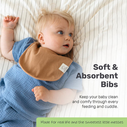 Toddler wearing a blue Lamb Babies Snug Drool Bib