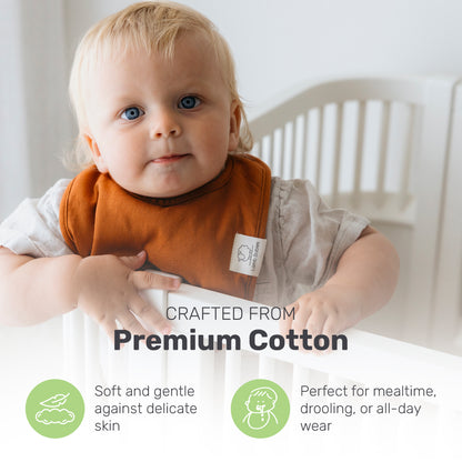 Toddler wearing a brown Lamb Babies Snug Drool Bib