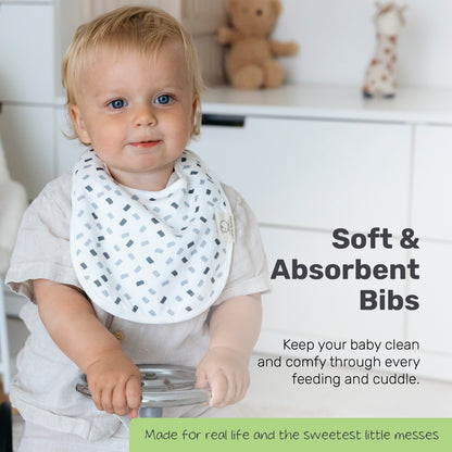 Toddler wearing a patterned Lamb Babies Snug Drool Bib