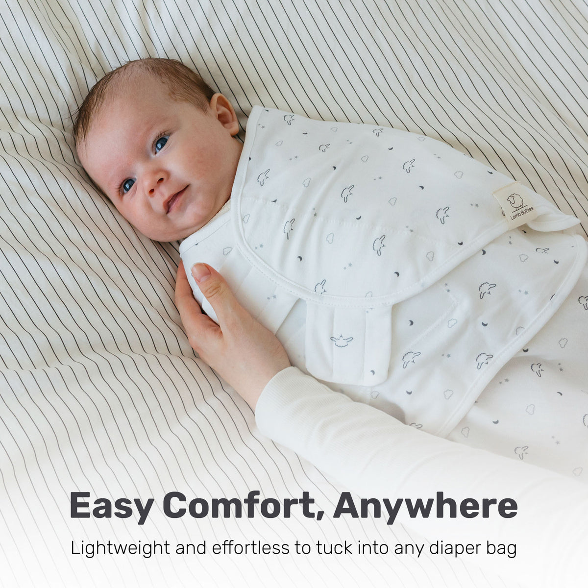 Baby sleeping in a Lamb Babies Snug Swaddle Wrap